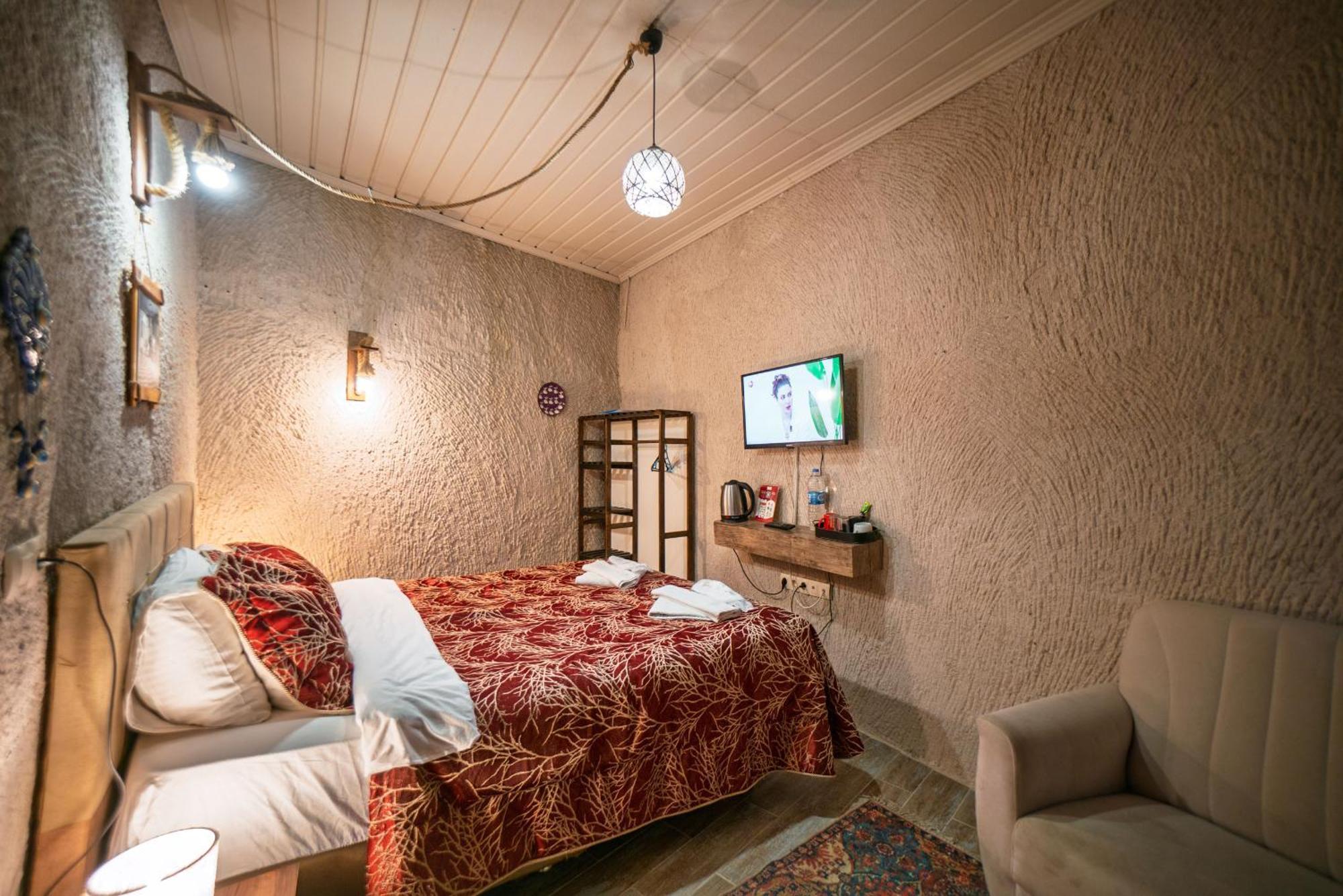 Adelya Cave Hotel Гьореме Номер фото